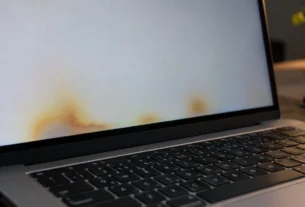 MacBook Pro screen showing yellow heat damage blotches