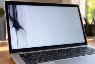 Laptop screen with a dark bruise-like blotch and colored lines, MacBook screen pressure damage
